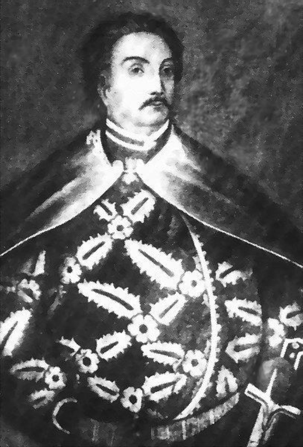 Schwarzes und weißes Foto von Papst Johannes Paul II. in Priesterrobe, der eine schwarze Robe mit weißem Kragen und Manschetten trägt und die Hände gefaltet hält.