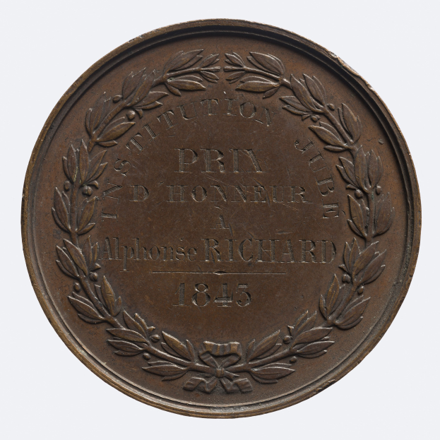 Bronzemedaille mit Lorbeerkranz-Design, mit Inschrift, vor weißem Hintergrund dargestellt.
